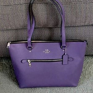 Coach purse in a beautiful purple color, for all those “purpleaholics”.